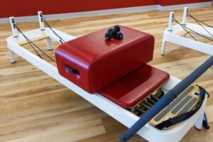 Pilates reformer, mat and weights