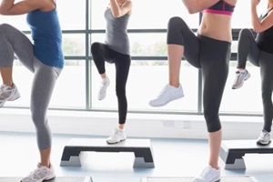DC women raising their legs while doing aerobics