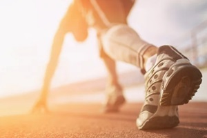 athlete runner feet running on treadmill closeup on shoe