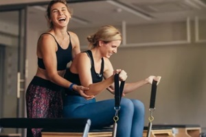 women having fun while doing pilates workout