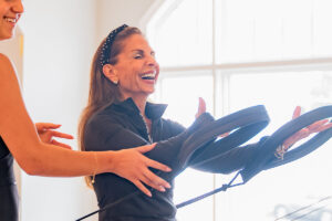 Joanne laughing in DC pilates class