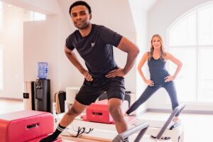 Northern Virginia Man doing lunges on Pilates Reformer