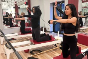 Single arm weight reformer pilates exercise