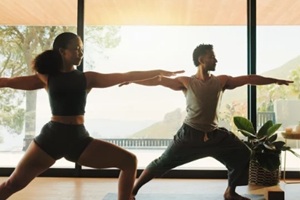 yoga and couple with fitness, meditation and bonding together with wellness